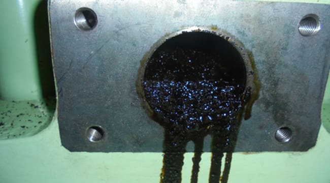 Sludge buildup in drain pipe running out
