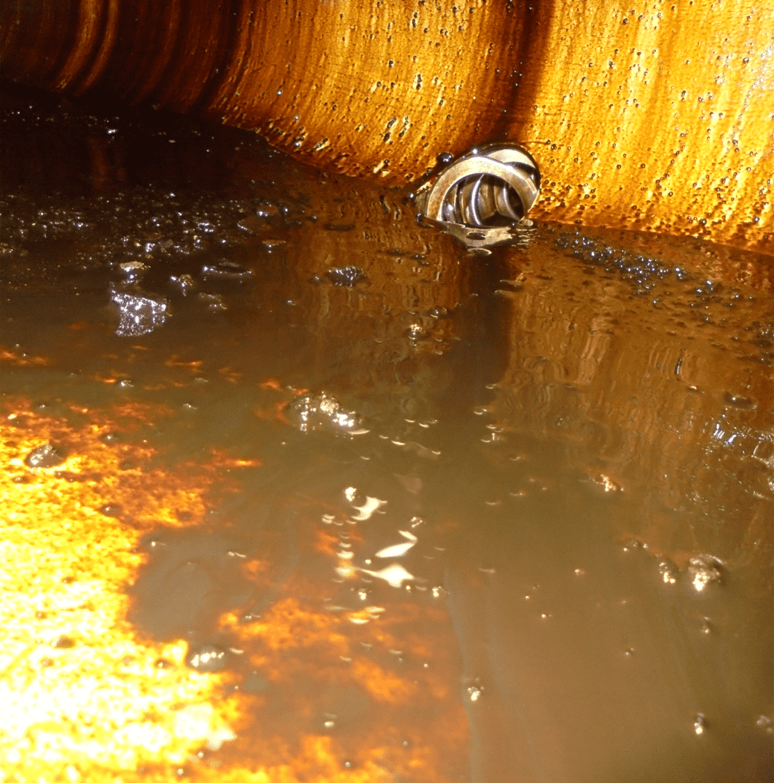 Small amount of sludge and oil after installation of Automatic Drain Cleaning System
