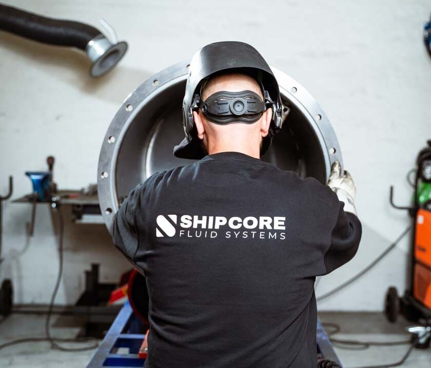 ShipCore engineer working on Sludge Collecting Unit for ships